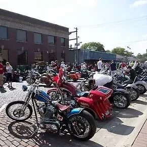 Row of custom motorcycles at the Applefest show in downtown Woodbine