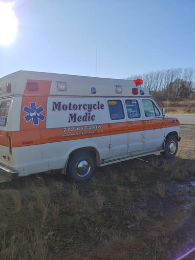 Retired ambulance lettered as the Motorcycle Medic shop van